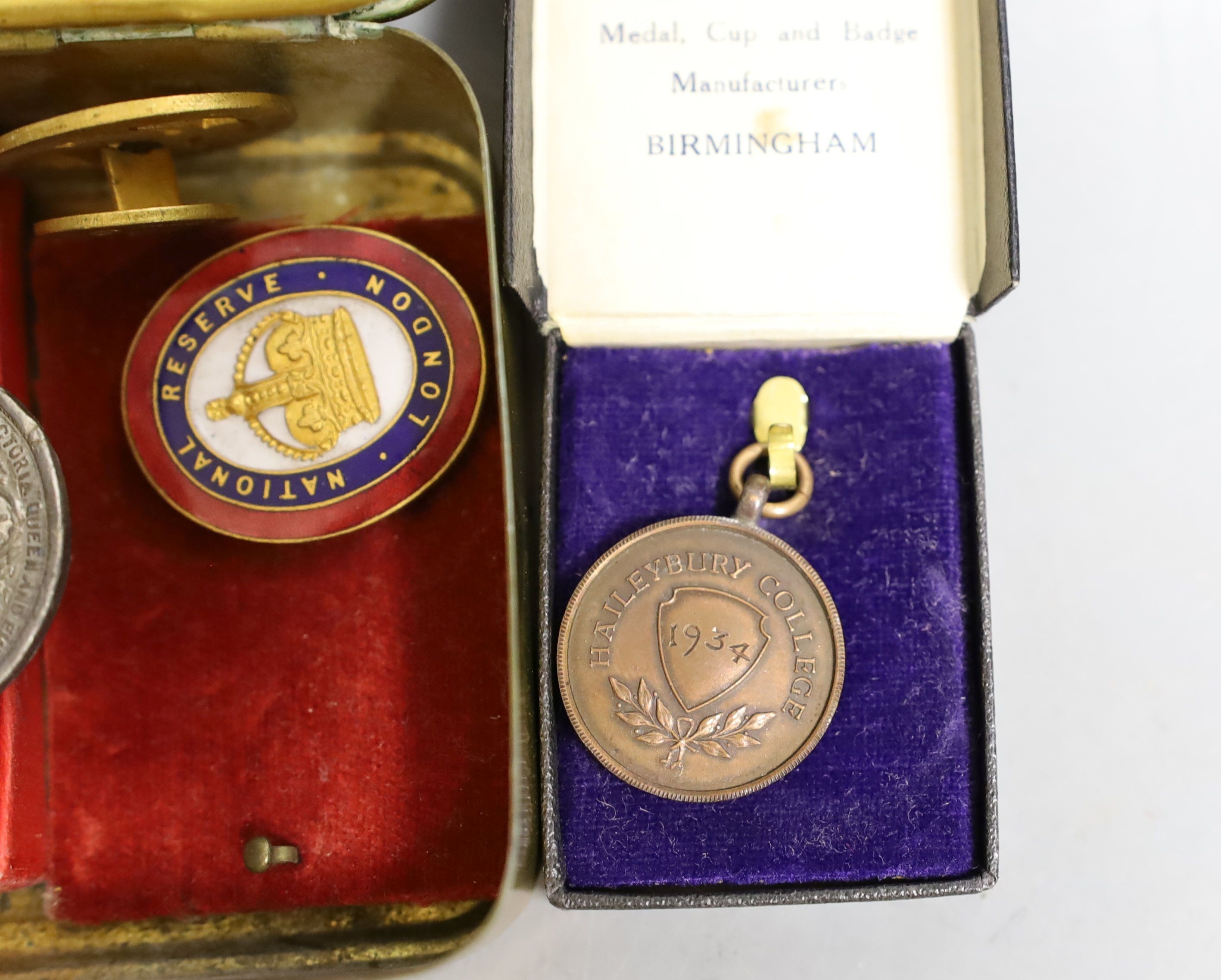 A WWI Queen Mary Christmas box, two National reserve London enamelled badges and two college medals to G. Lovegrove